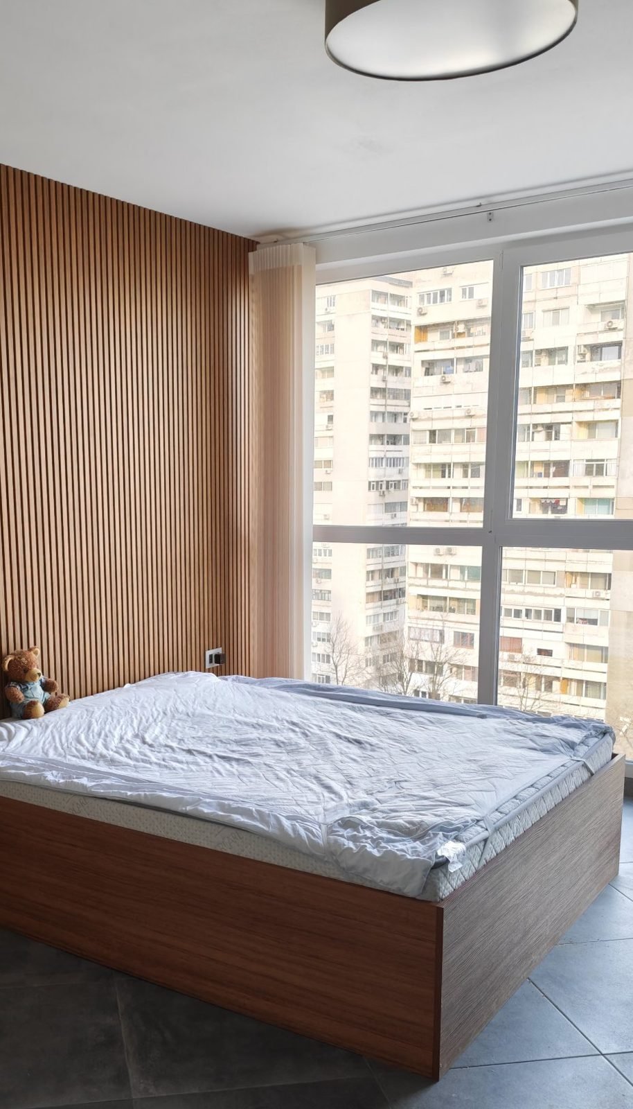 Custom bedroom in Burgas – bed and slatted feature wall by Dovetail